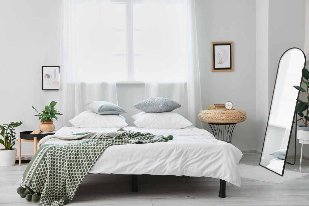 Interior of stylish bedroom with comfortable bed